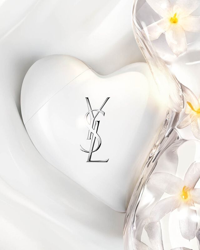 CARE CRUSH white heart case on silky serum-in-cream texture waves with fresh jasmine flowers. Luminous skincare.