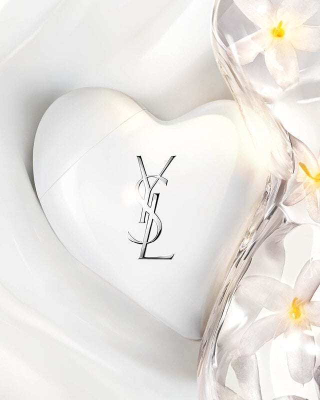 CARE CRUSH white heart case on silky serum-in-cream texture waves with fresh jasmine flowers. Luminous skincare.
