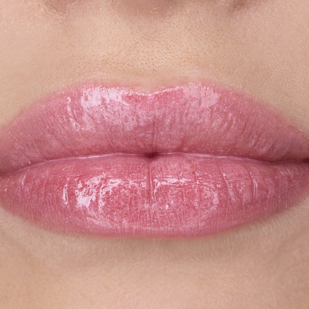 Nessie's lips wearing YSL LOVESHINE Lipstick in shade 10 Stardust
Love, a glossy pink.