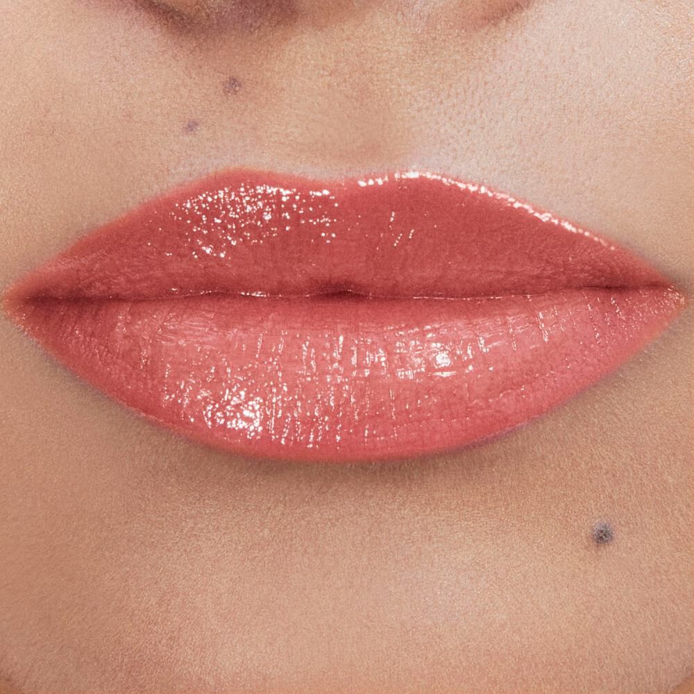 Andrea's lips wearing YSL LOVESHINE Lipstick in shade 214 Wet
Guava, a glossy coral-pink.